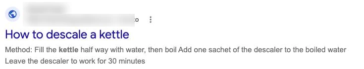 A Google search result showing a blue page title, How to descale a kettle, with a short meta description snippet beneath